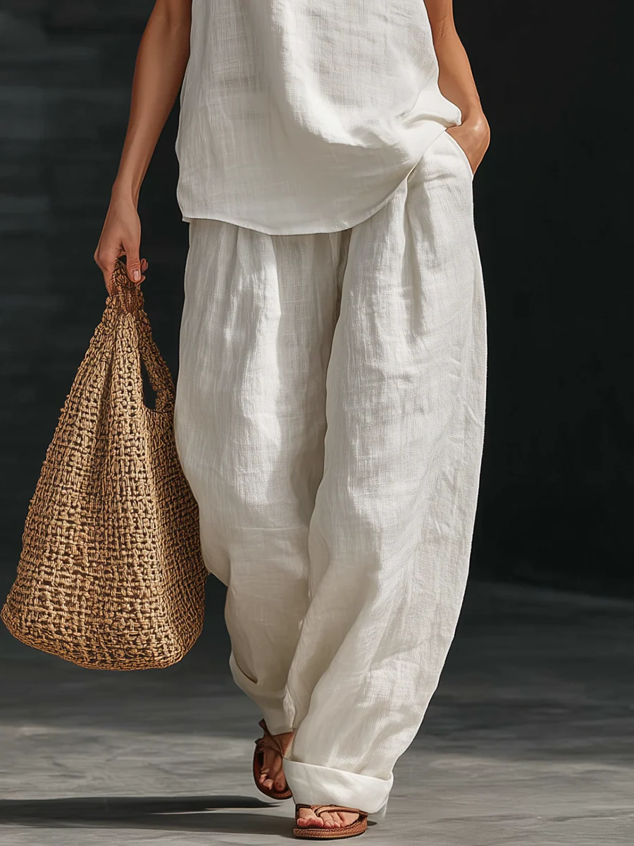 Ensemble sans manches et pantalon large Zoë™ de Danoir Paris, tissu fluide et élégant, couleur jaune pastel.