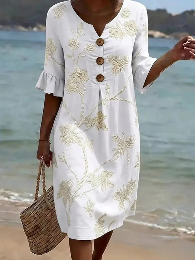Robe décontractée pour femme Danoir Paris avec motif floral blanc, tissu léger et style casual.