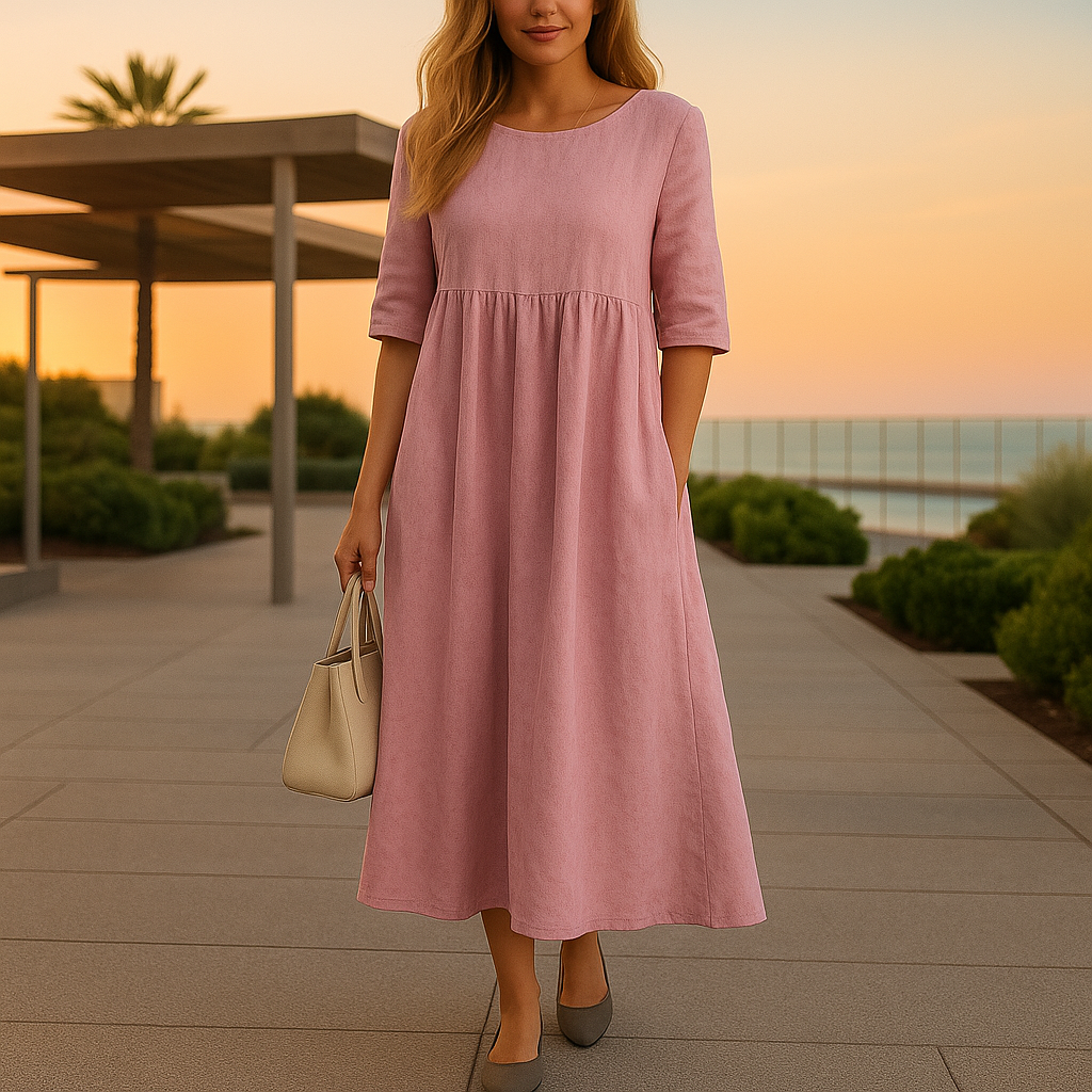 Robe en coton aérée Manon de Danoir Paris, élégante pour une promenade au coucher du soleil, vue en gros plan.