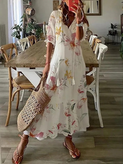 Robe bohème chic Ines de Danoir Paris en tissu bleu, avec détails élégants et style décontracté.