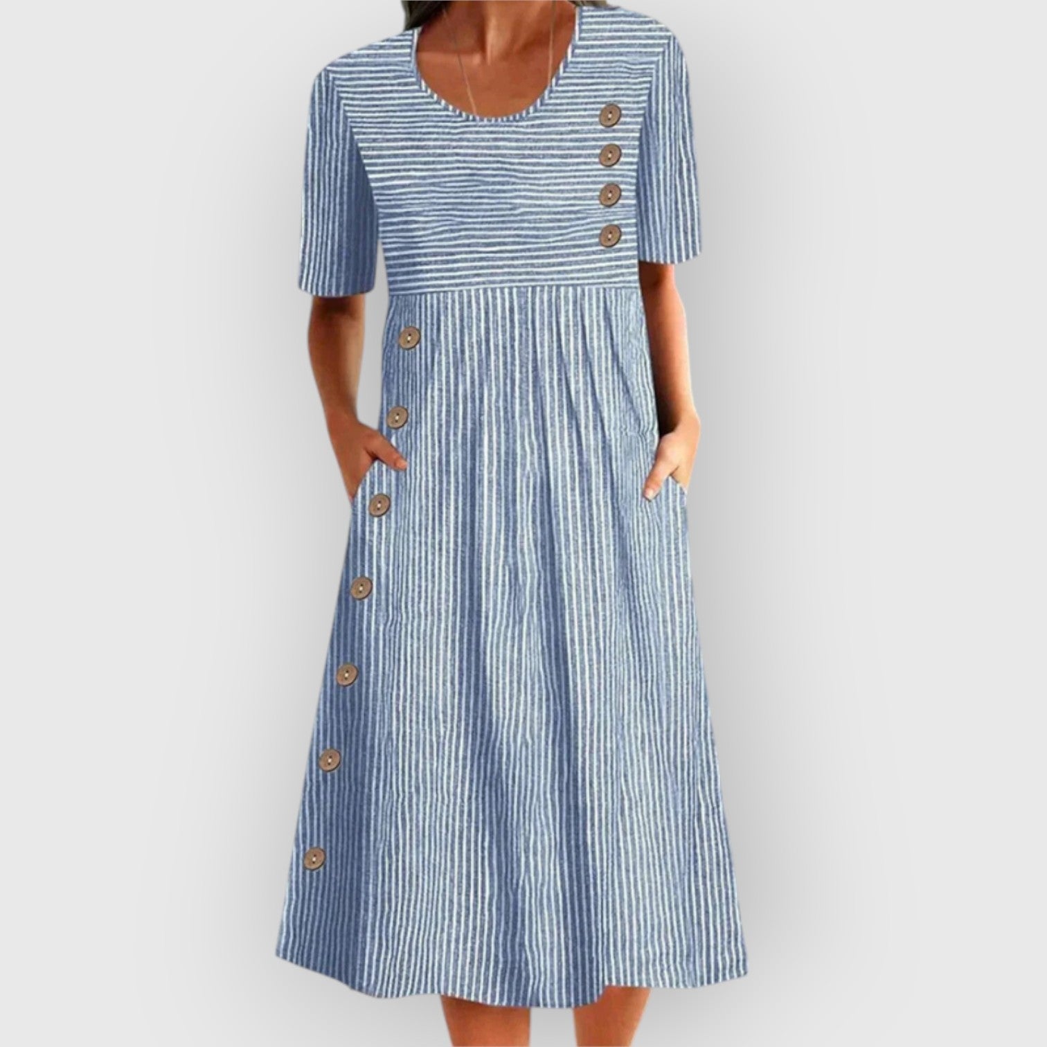 Robe midi à rayures en coton Danoir Paris, style élégant, longueur mi-mollet, tissu léger avec motifs rayés.