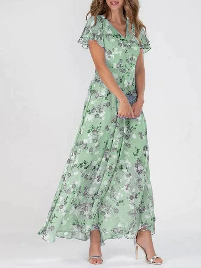 Robe maxi fleurie élégante Danoir Paris, tissu fluide avec motif floral, longueur jusqu'aux chevilles, style sophistiqué et féminin.