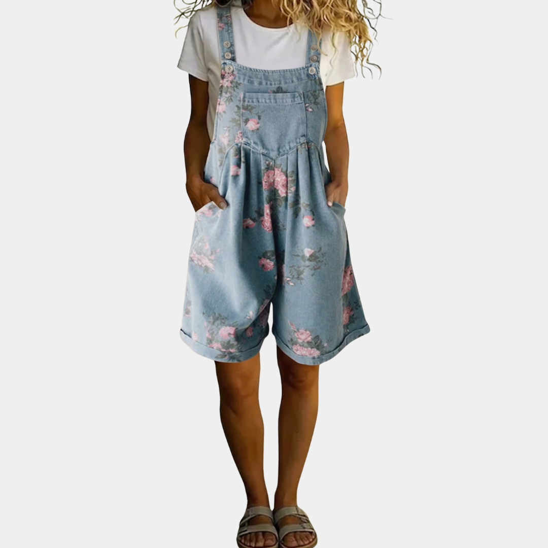 Salopette en denim vintage à fleurs Judy de Danoir Paris, avec bretelles et coupe décontractée, pour un style rétro et floral.