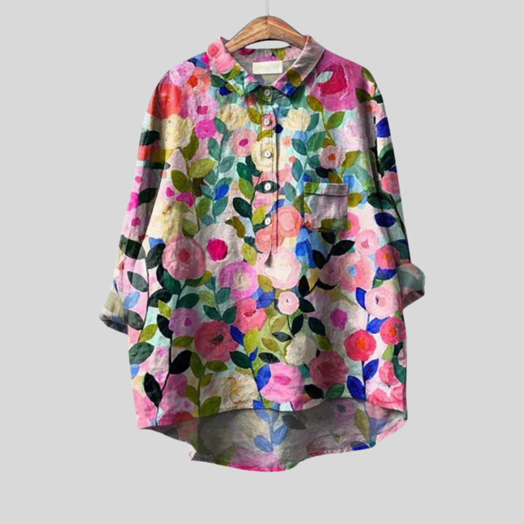 Blouse florale artistique de Danoir Paris, tissu léger avec motif floral coloré, manches longues et coupe élégante.