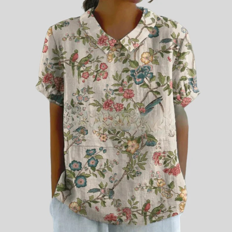Blouse Clarélia™ à fleurs délicates de Danoir Paris, vêtement féminin en tissu léger, style élégant et floral.