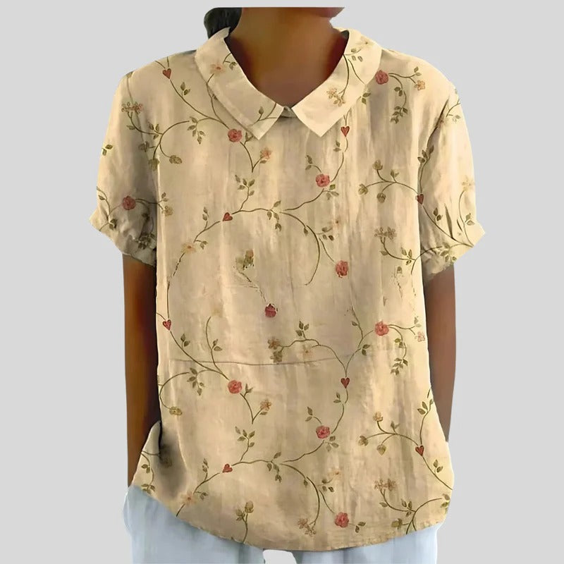 Blouse Clarélia™ à fleurs délicates de Danoir Paris, vêtement pour femme avec motif floral élégant et design moderne.