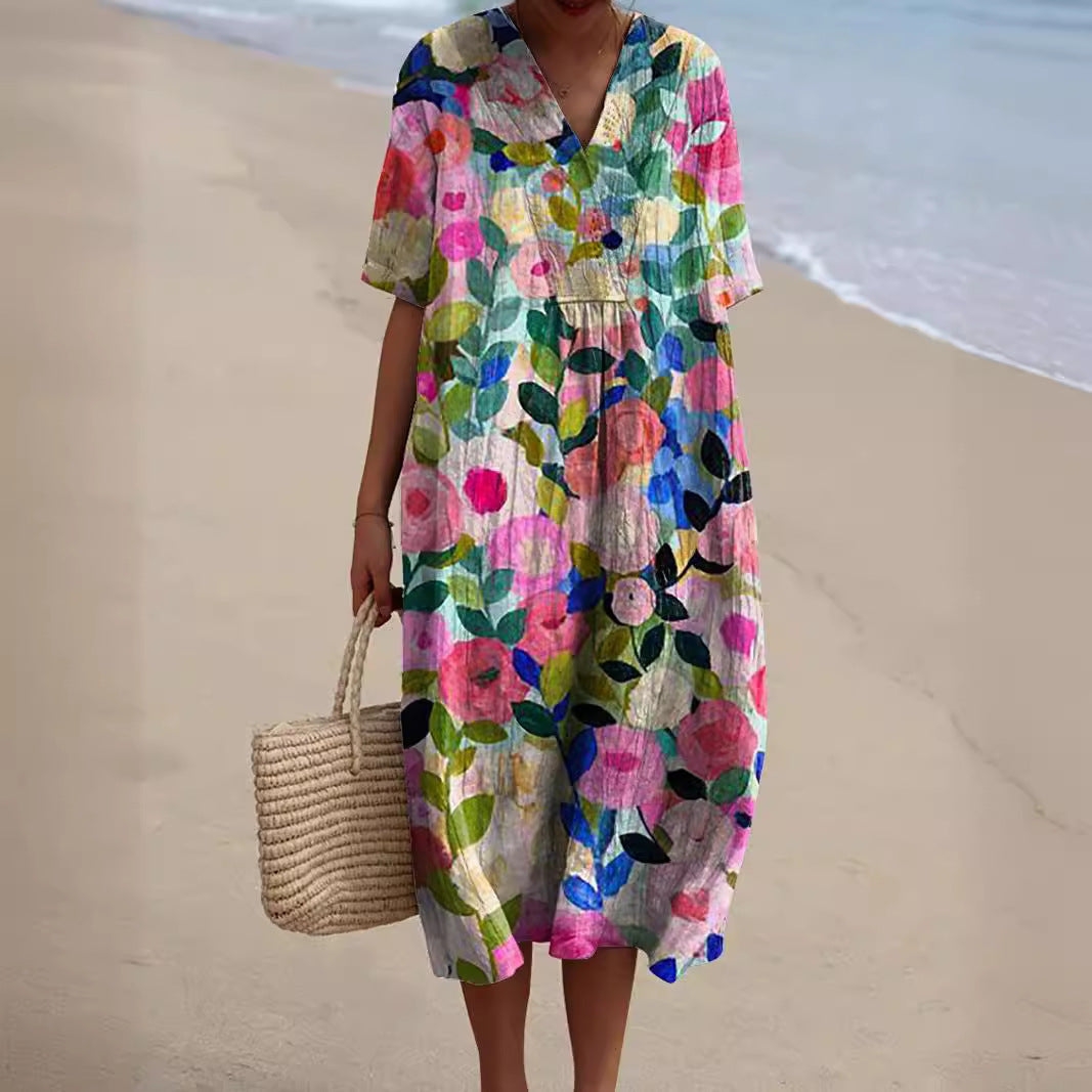 Robe florale éclatante Nicka par Danoir Paris portée, avec motifs colorés et coupe élégante, vue de face.