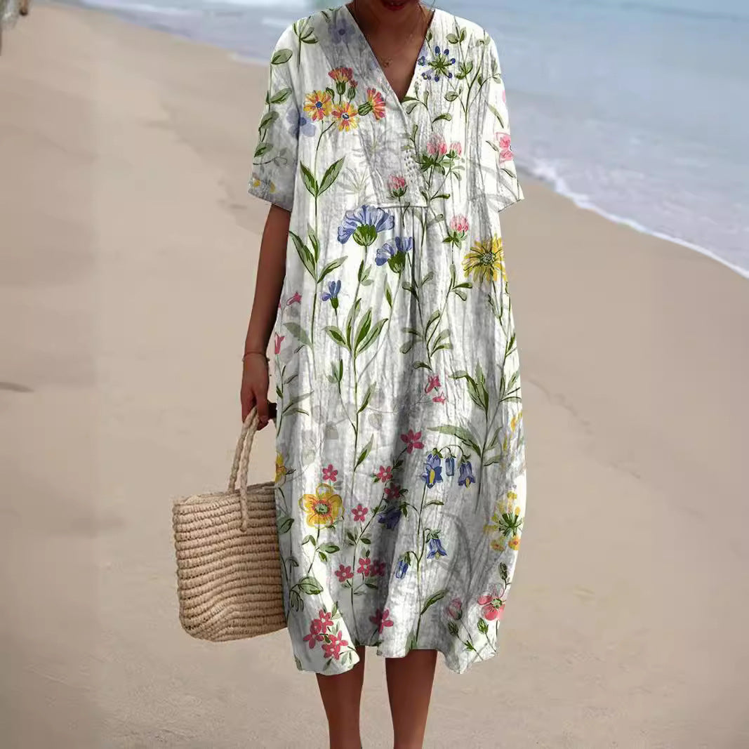 Robe florale éclatante Nicka de Danoir Paris affichée en gros plan, motif coloré et tissu fluide pour une allure élégante.