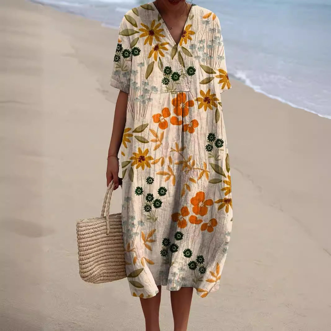 Robe florale éclatante Nicka de Danoir Paris, tissu léger avec imprimé floral coloré, portée élégante et féminine.