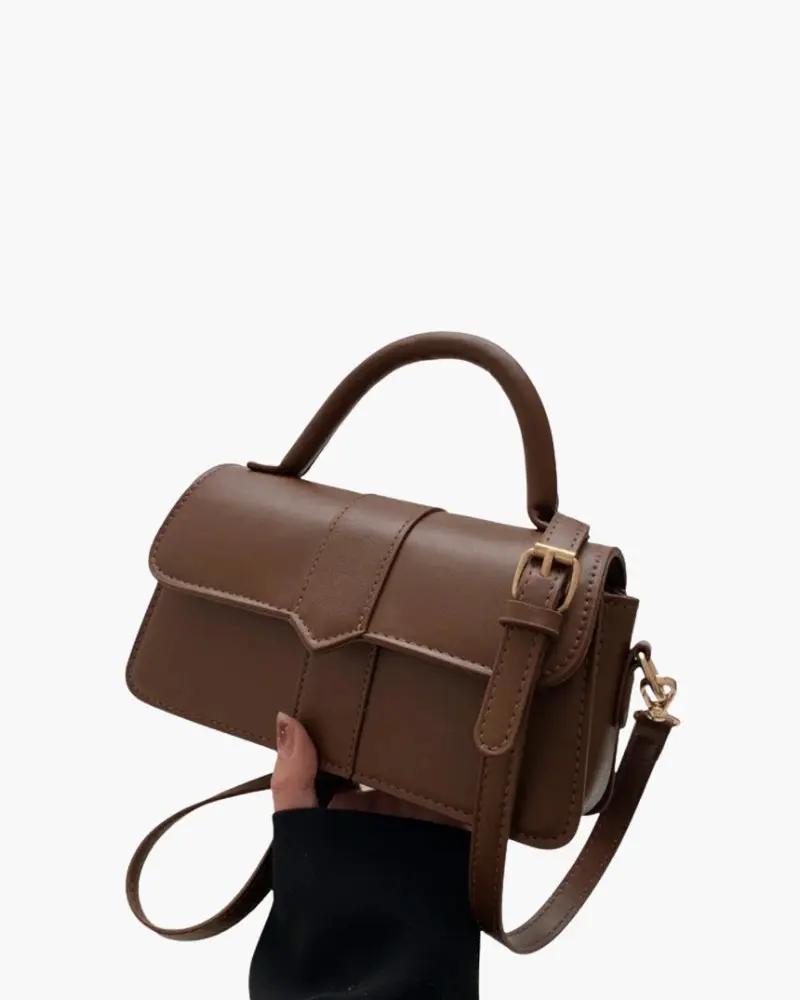 Sac à main Paris Danoir Paris en cuir avec poignées et fermeture élégante, vue de face sur fond neutre.
