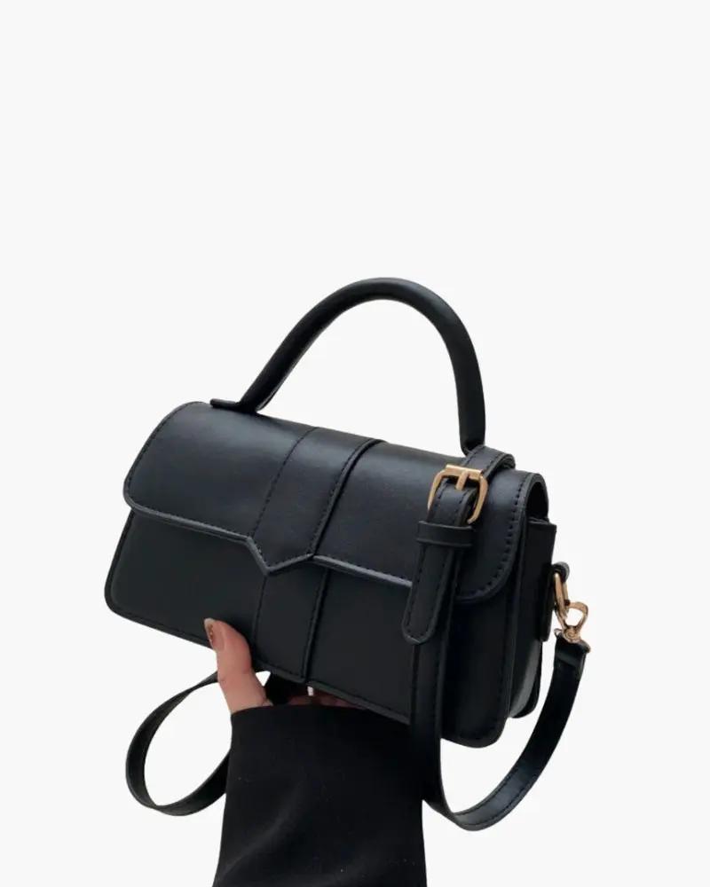Sac à main Paris de Danoir Paris, élégant avec détails vintage, vue sur le devant et la poignée en cuir.