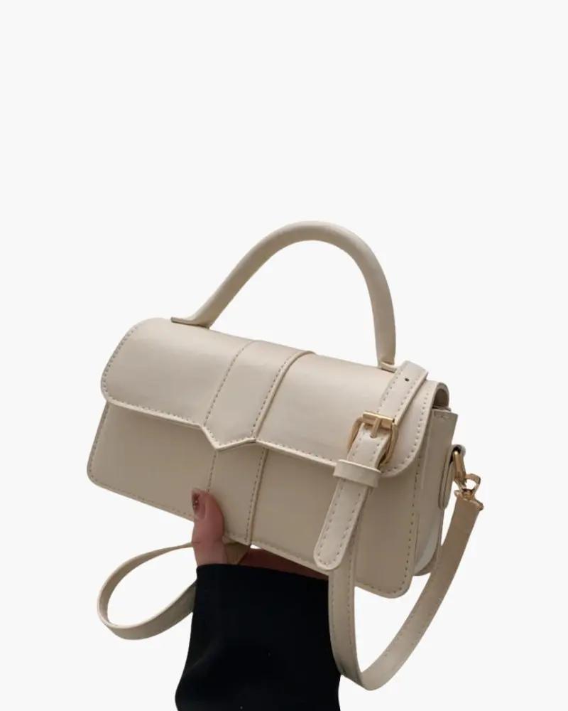 Sac à main The Paris Danoir Paris en cuir avec poignées élégantes et détails sophistiqués, vue de face.