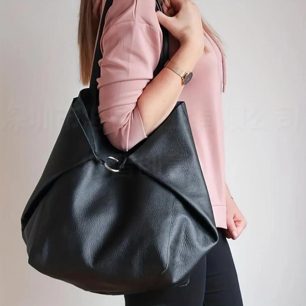Grand sac à main vintage Danoir Paris Renee, élégant et spacieux, en cuir avec détails inspirés du style rétro.