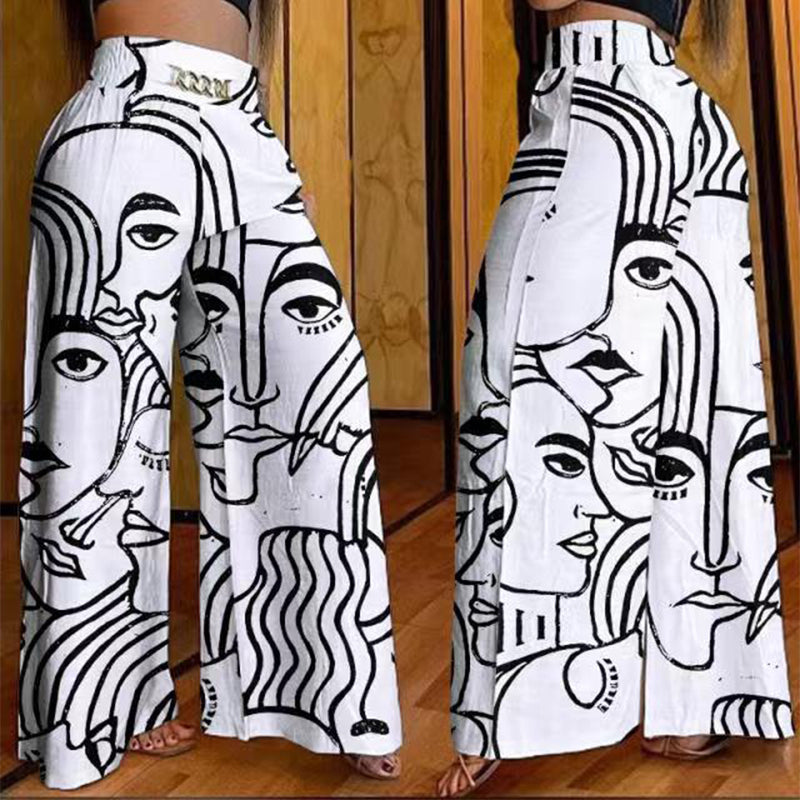 Pantalon large taille haute sculptant Évelyne™ de Danoir Paris, en tissu noir avec taille élastique et coupe flatteuse.