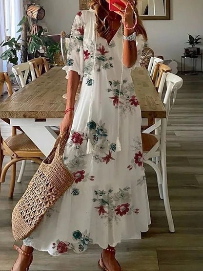 Robe midi boho sans effort Luna de Danoir Paris, tissu fluide bleu avec motifs élégants et coupe décontractée.