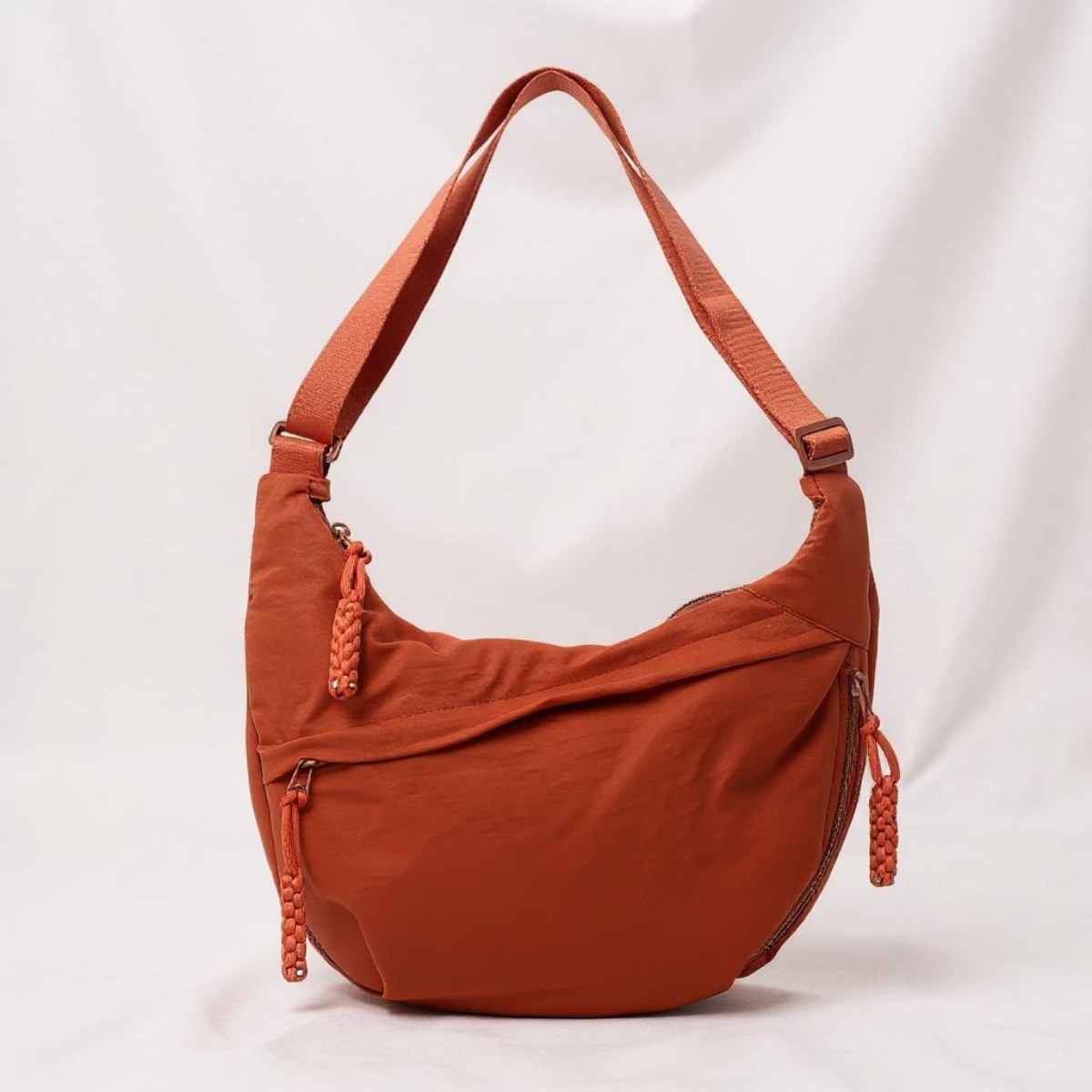 Sac à bandoulière orange Danoir Paris Gioia, en cuir avec bandoulière ajustable et design élégant.