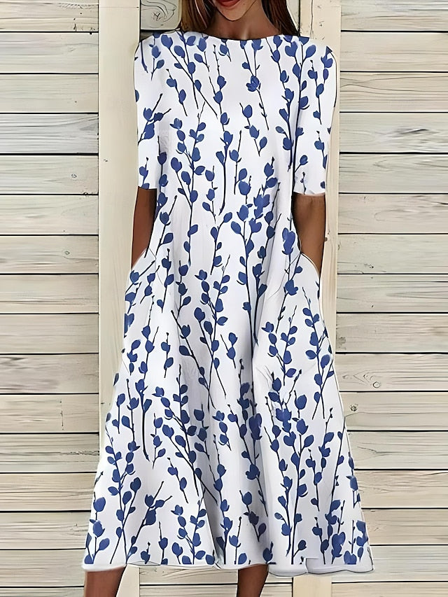 Robe Carlee Coastal Bloom de Danoir Paris, robe d'été à imprimé floral, tissu léger et style élégant.