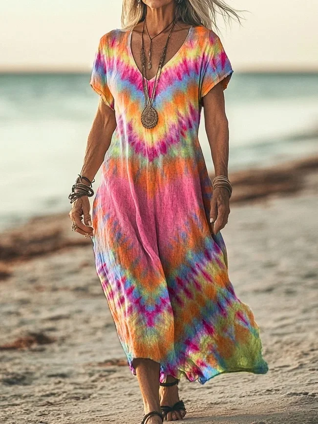 Robe en coton Norae élégante de Danoir Paris, robe longue avec manches courtes et design sobre, portée dans un cadre élégant.