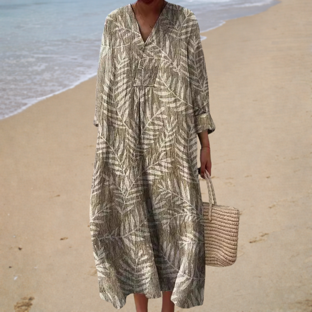 Robe longue élégante Léonie de Danoir Paris en tissu naturel, profil visible sur fond blanc, style sophistiqué et fluide.