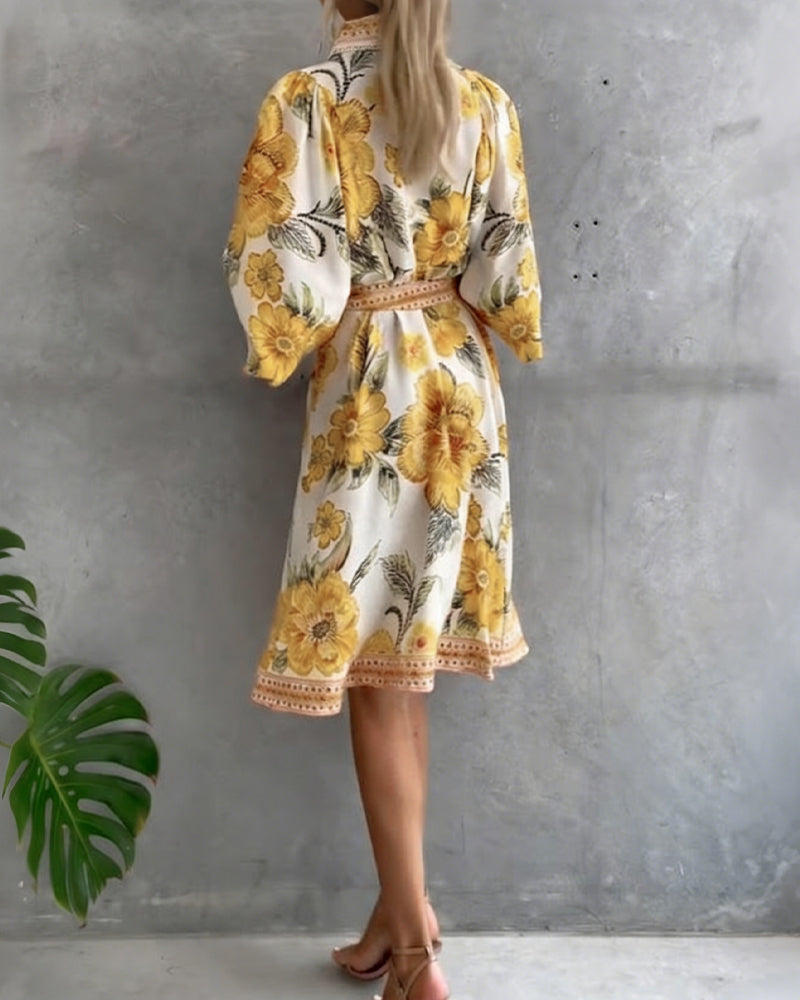 Robe Danoir Paris à manches lanternes, col cranté et imprimé, vêtement élégant et féminin pour occasions spéciales.