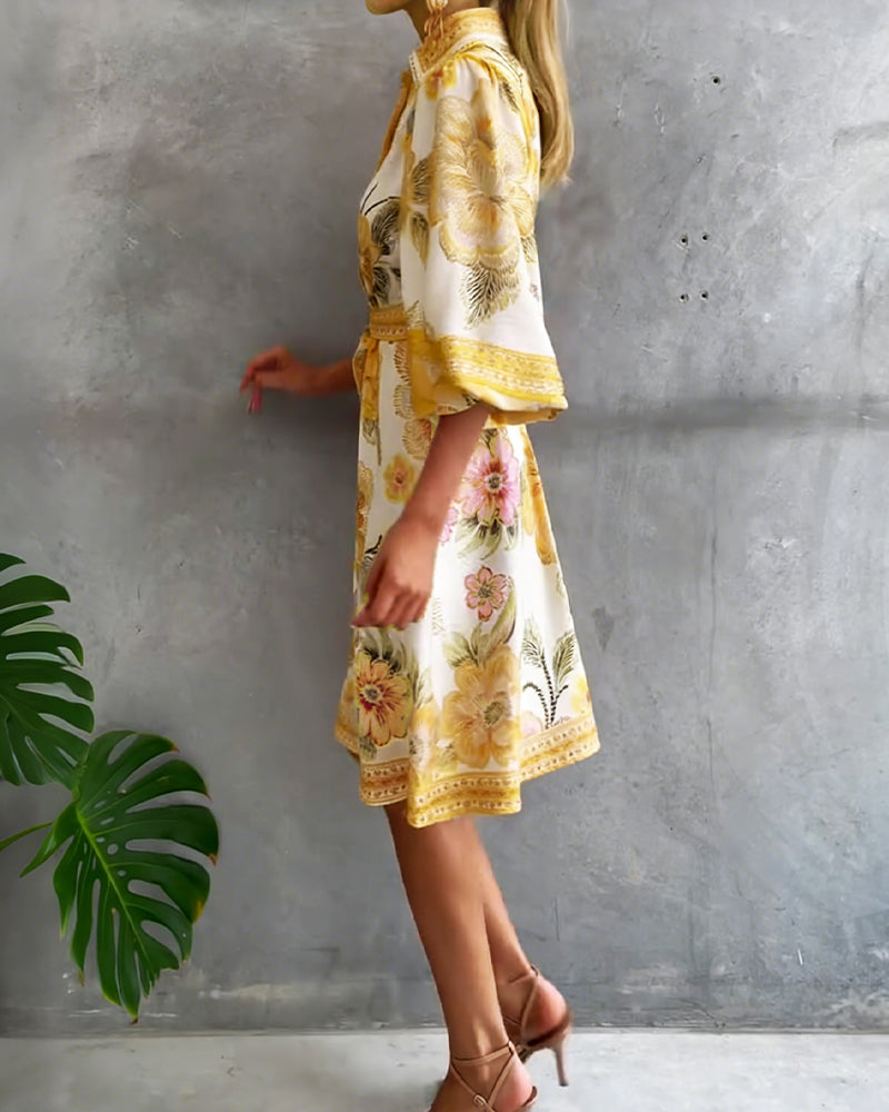 Robe Danoir Paris manches lanternes, col cranté et imprimé floral, longueur midi, style élégant et féminin.