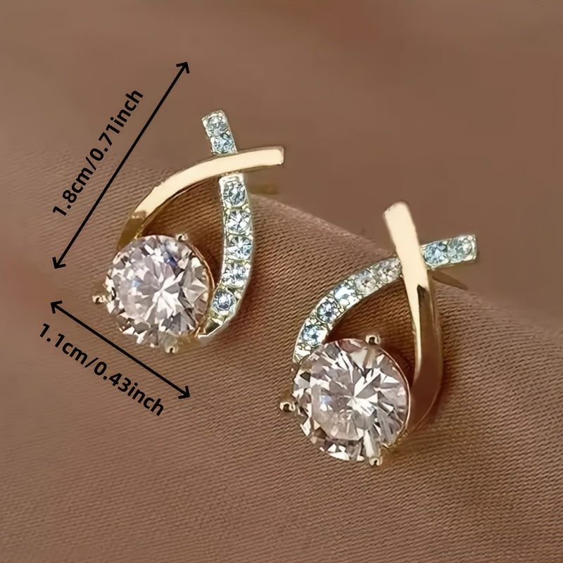 Boucles d'oreilles en puce Danoir Paris avec croix dorée et zirconiums, élégantes et raffinées.