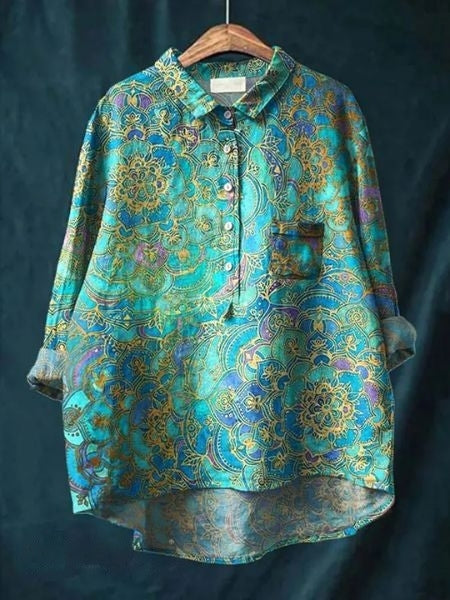 Blouse florale élégante Lila de Danoir Paris, tissu fluide, manches longues et motif floral coloré, parfaite pour une tenue sophistiquée.