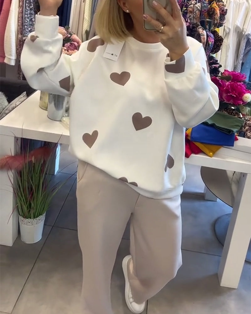 Pull Mila Danoir Paris en coton doux avec motif de cœurs, manches longues et coupe confortable pour un style décontracté.