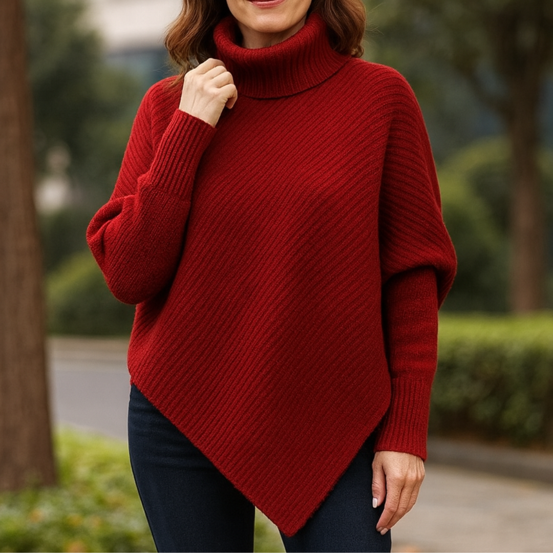 Poncho Anneta Danoir Paris, pull confortable en tissu doux, porté en mode décontracté, couleur neutre, style chic et cosy.
