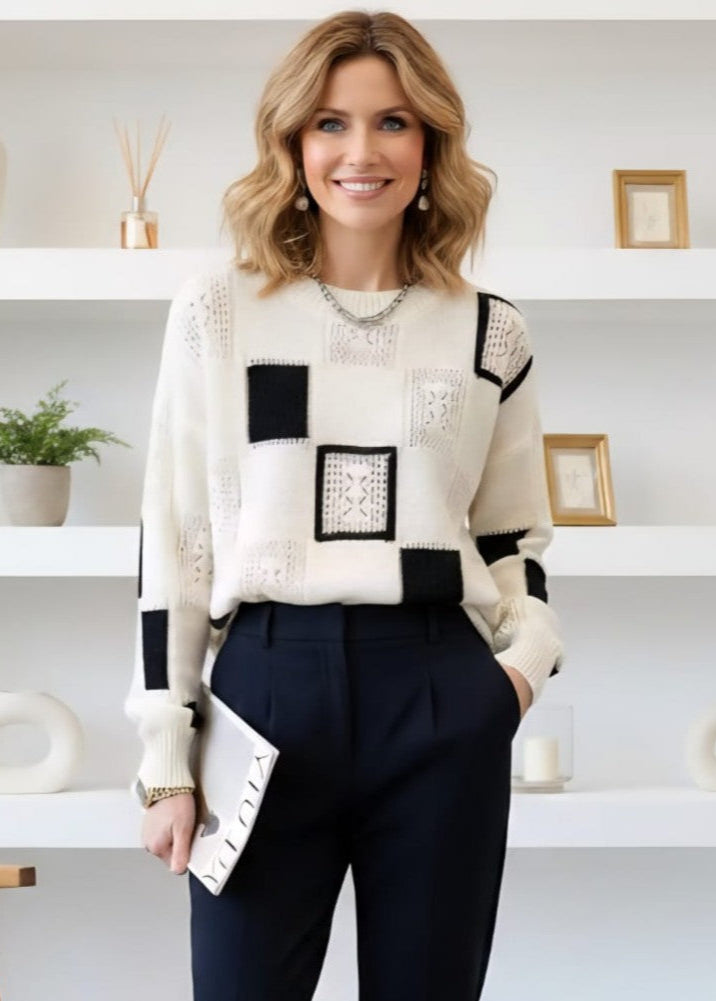 Pull rétro chic Roby de Danoir Paris en laine, détail vintage, coupe élégante, couleur neutre, porté sur mannequin.