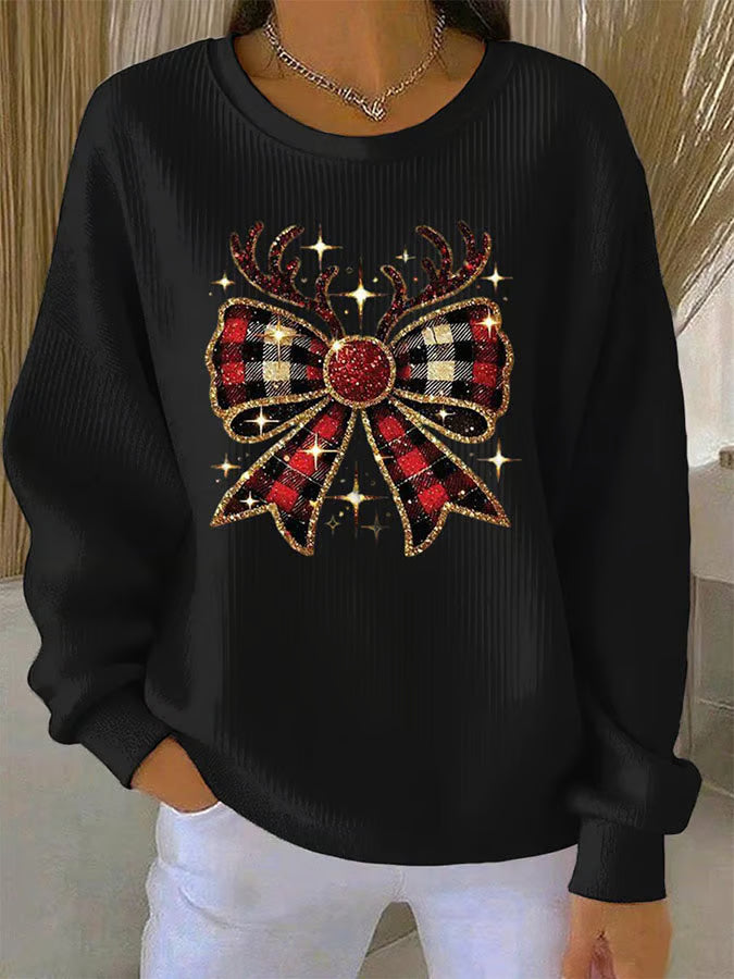 Pull festif Elin de Danoir Paris, en tricot avec motif à rayures, porté façon élégante pour la saison hivernale.
