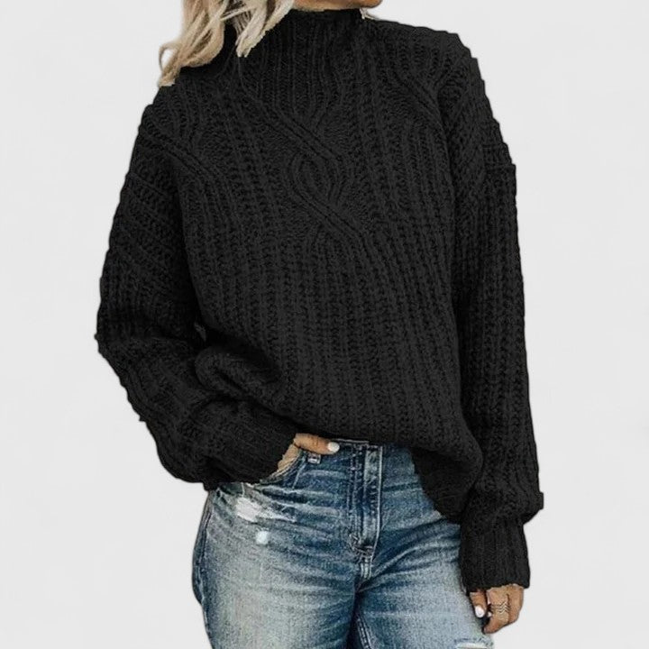 Pull torsadé élégant Lerynna de Danoir Paris, couleur neutre, avec détails tressés, porté sur mannequin.