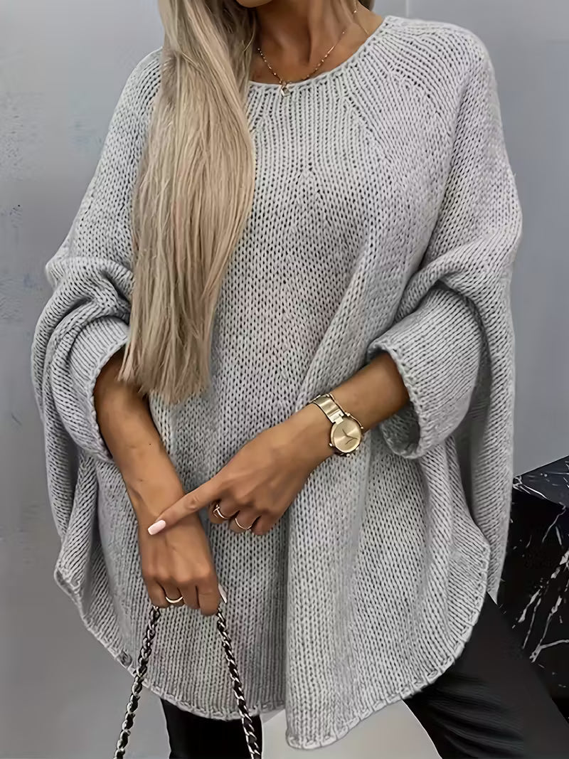 Gilet tricoté élégant Betsi de Danoir Paris, veste en maille fine avec col en V et détails sophistiqués, porté dans un look chic.