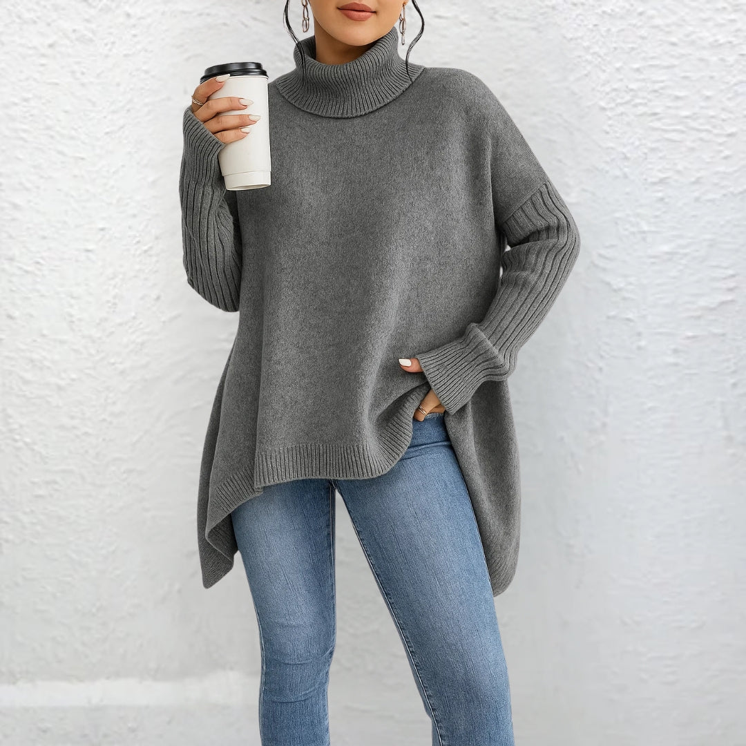 Pull polo élégant Brigitte de Danoir Paris, en maille douce, couleur neutre, avec col classique et détails sophistiqués.