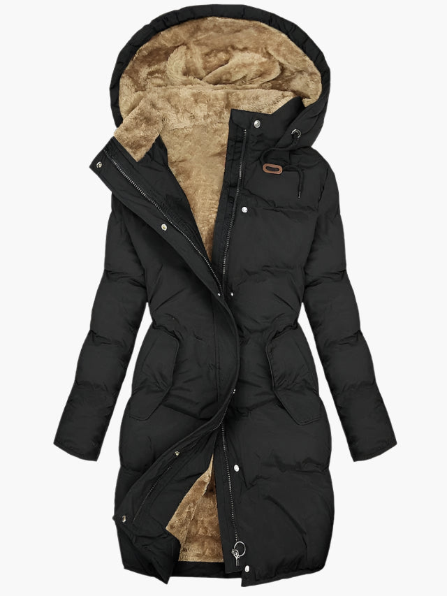 Manteau hivernal élégant Olivia de Danoir Paris en vert, coupe sophistiquée et tissu chaud pour femmes.