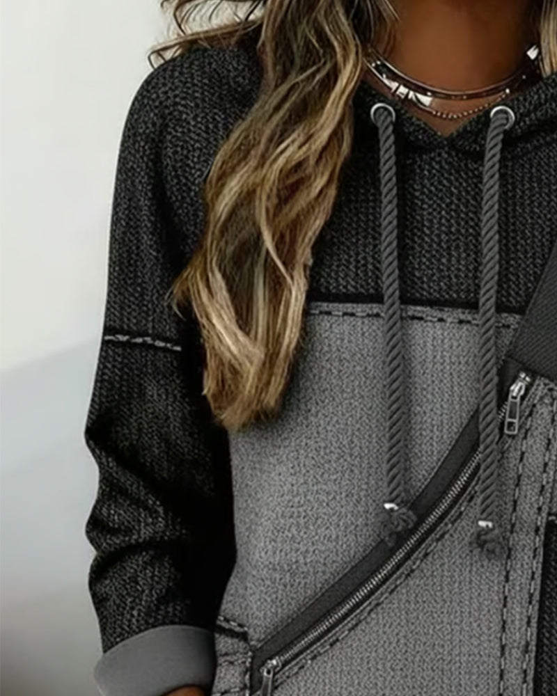 Hoodie color-block urbain Rosita de Danoir Paris, style décontracté avec détails colorés, porté en extérieur.