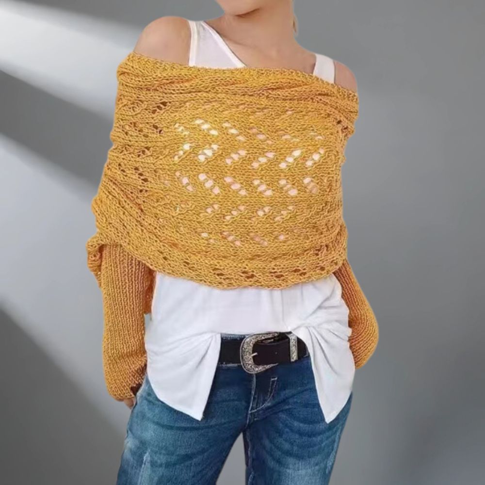 Châle tissé WarmWrap™ de Danoir Paris, élégant et chaud, avec motifs sophistiqués, porté enroulé autour du cou.