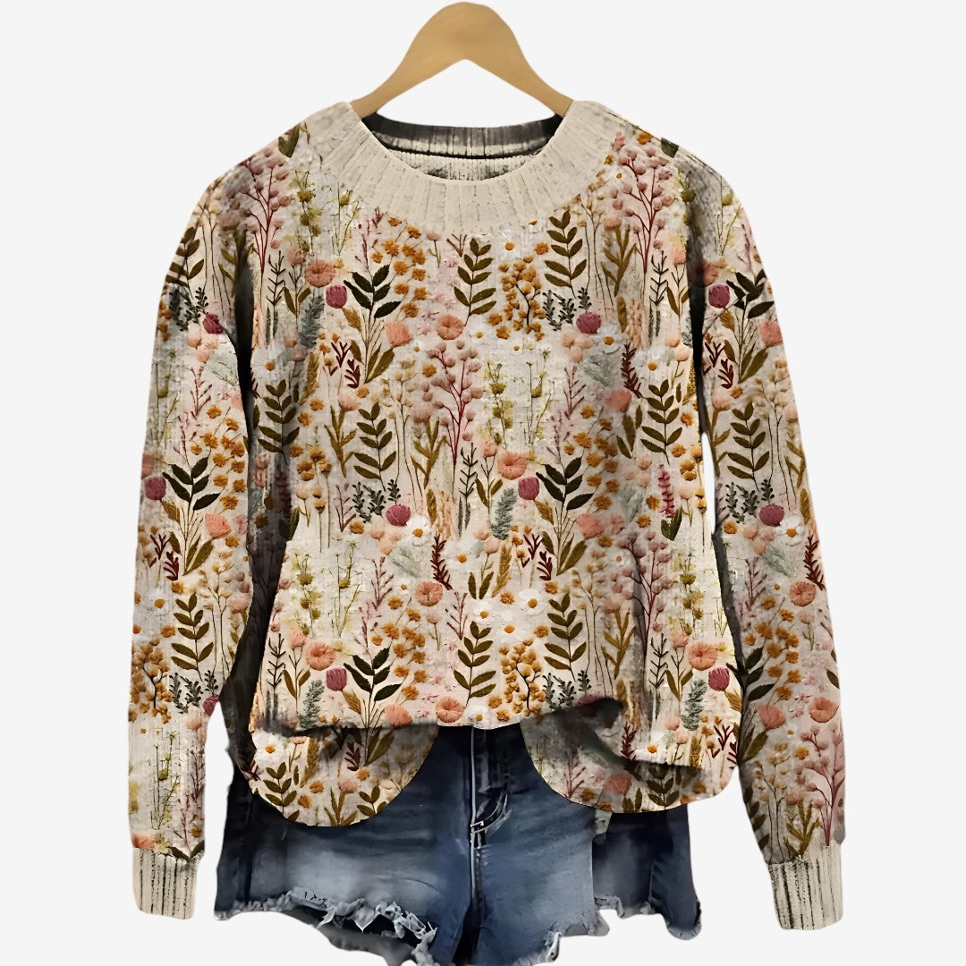 Pull floral élégant Nova de Danoir Paris, vue de face avec motifs floraux colorés et coupe sophistiquée.