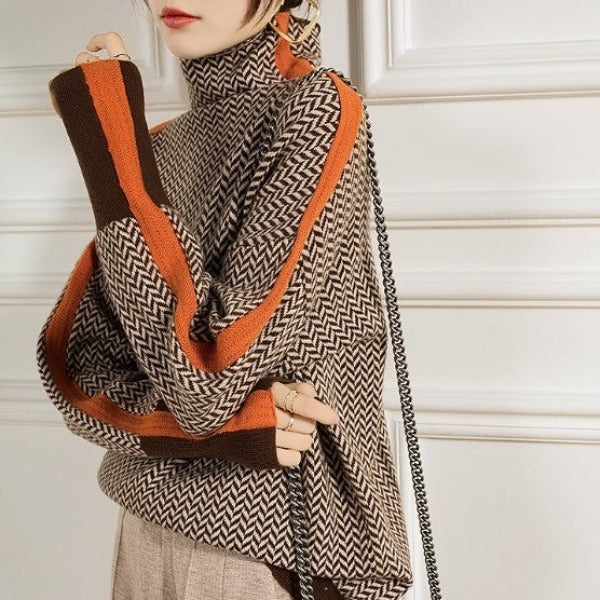 Pull roulé orange Sylvie de Danoir Paris, élégant, en tissu doux, porté sur mannequin, style chic et moderne.