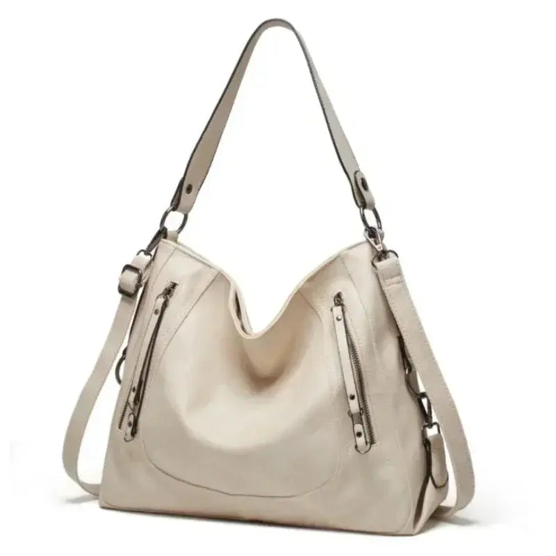 Sac Nora Danoir Paris élégant en cuir avec poignée, idéal pour un look chic et pratique au quotidien.