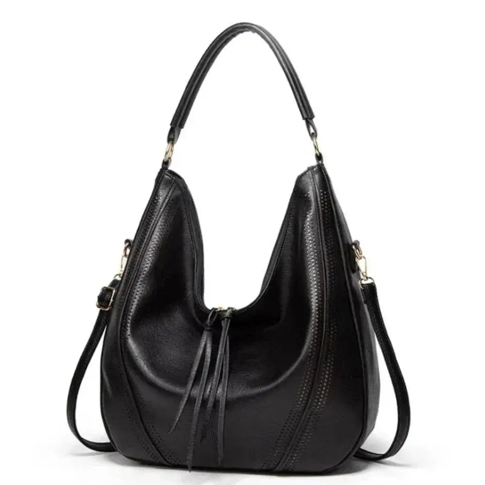 Sac vintage Danoir Paris Anya, sac à main intemporel et polyvalent en cuir avec poignées et détails élégants.
