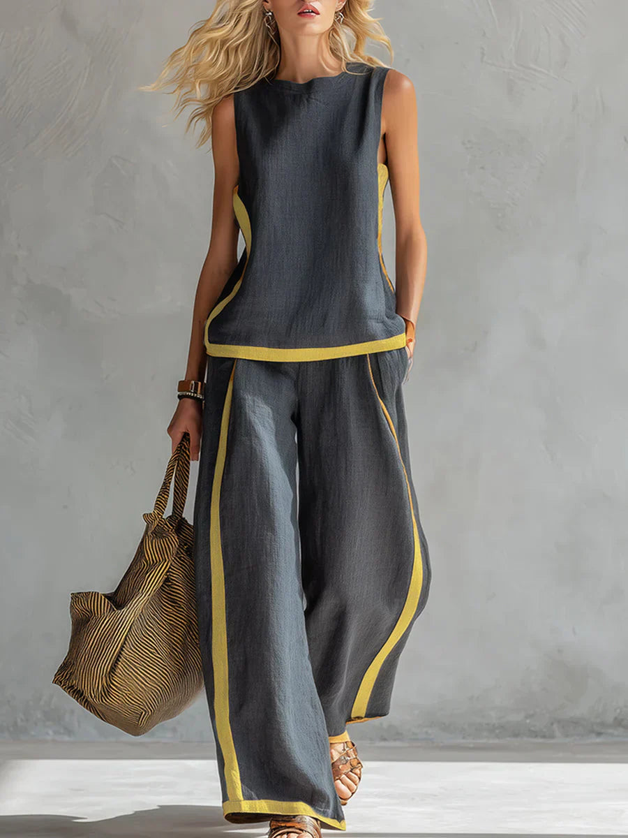 Ensemble Ursula Danoir Paris, gilet et pantalon chic-décontracté avec finitions bicolores, vêtement gris élégant et moderne.
