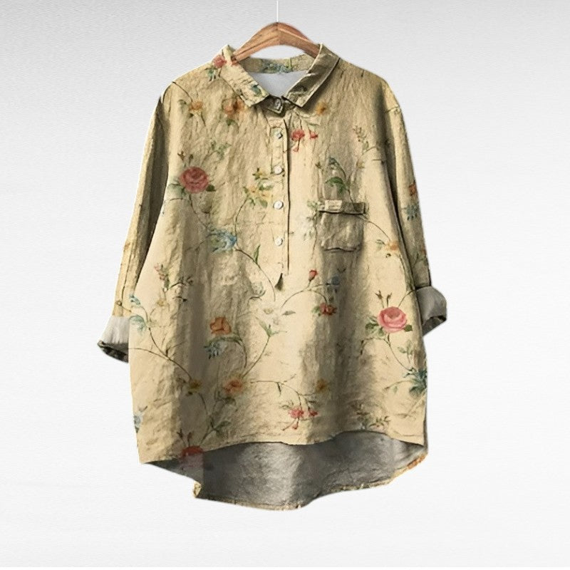 Blouse fleurie rétro Marjolaine par Danoir Paris, tissu léger avec motifs floraux colorés, manches longues et coupe élégante.