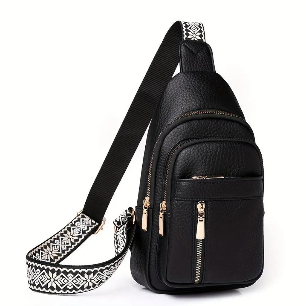 Sac à bandoulière Fiona de Danoir Paris avec roulettes, en cuir noir, visible avec poignées et roulettes pour déplacement facile.