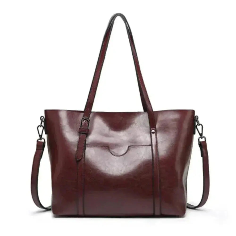 Sac de luxe Blythe Danoir Paris en cuir élégant, avec poignée en chaîne et détails sophistiqués, pour un style intemporel.
