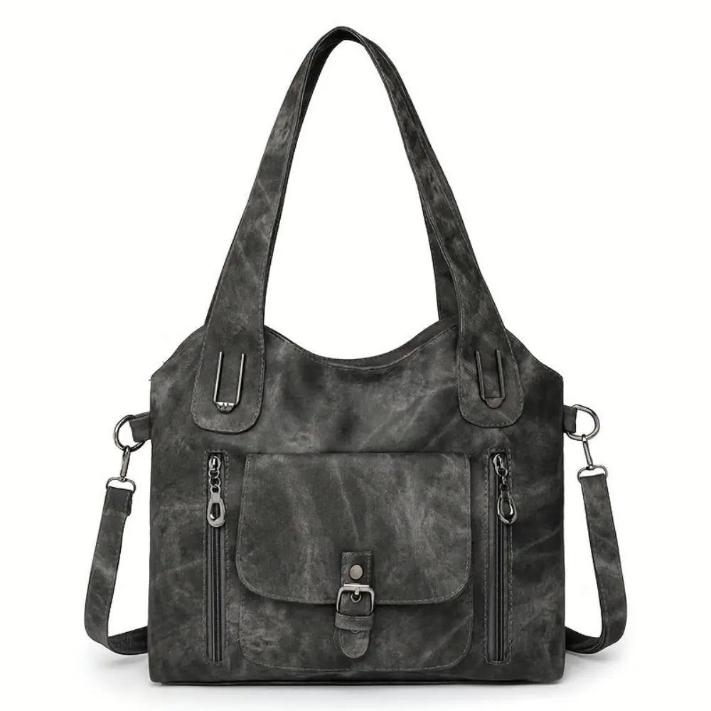 Sac à bandoulière Cecilia de Danoir Paris en cuir élégant, couleur beige, avec poignées et détails sophistiqués.