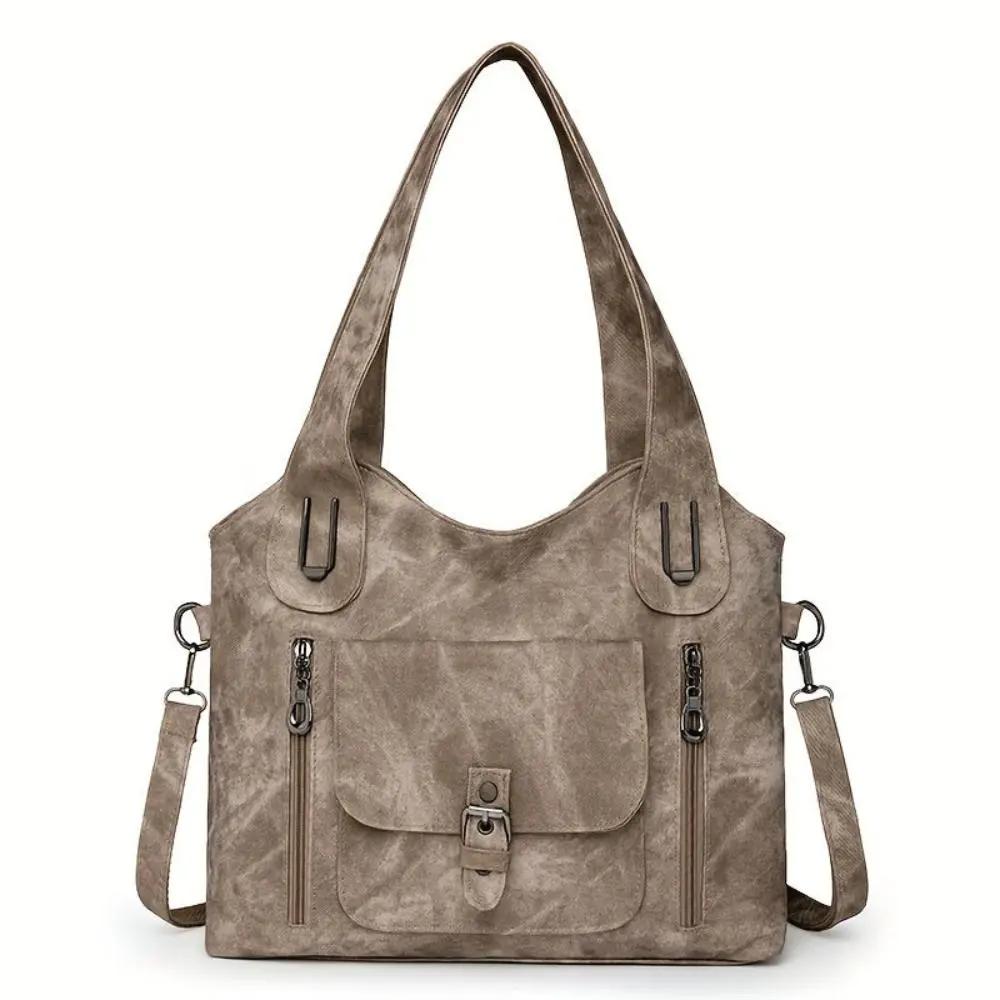 Sac à bandoulière Cecilia de Danoir Paris en cuir élégant, couleur beige, avec fermeture métallique et bandoulière ajustable.