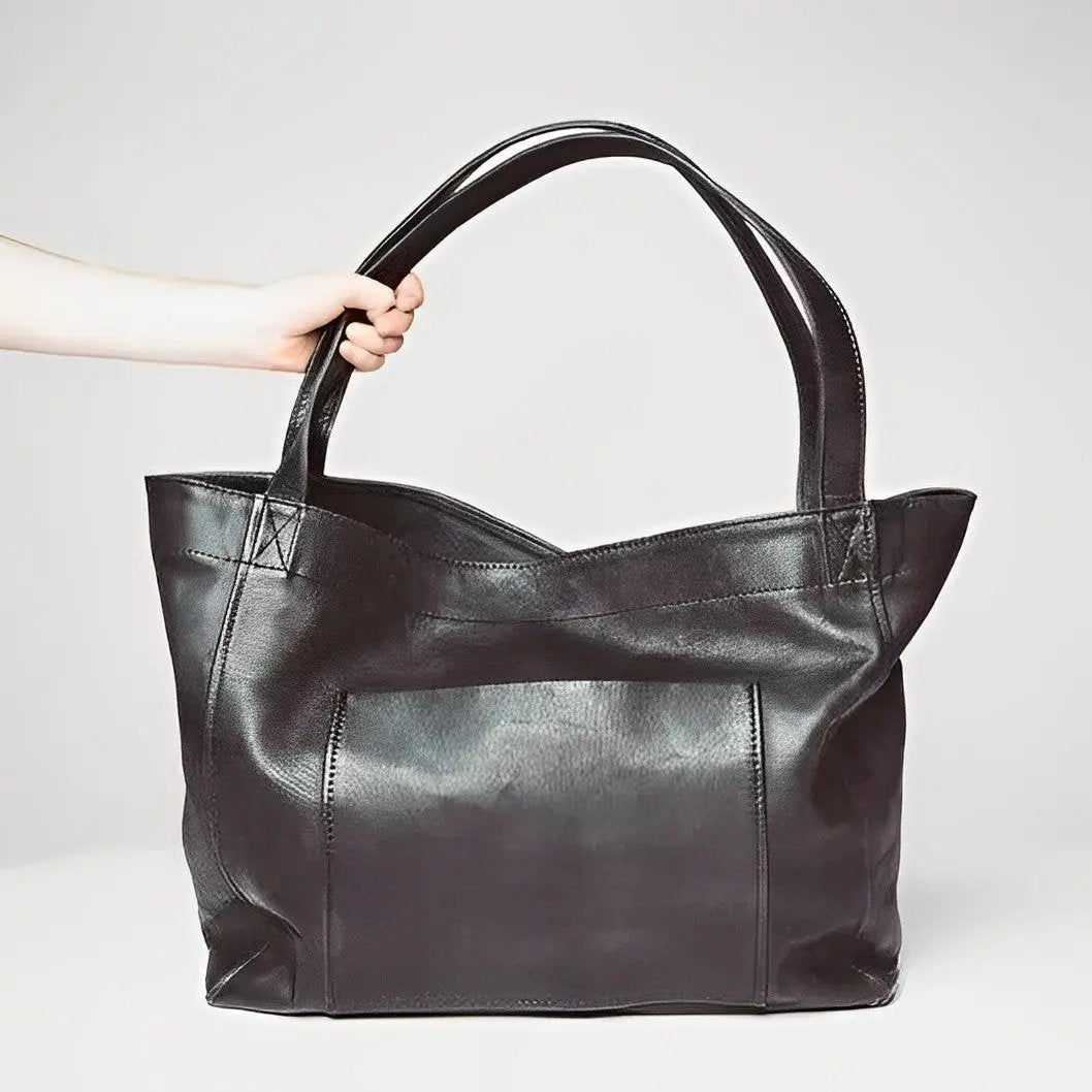 Sac en cuir rétro Élise de Danoir Paris, sac à main élégant avec finition vintage et détails en cuir brun.