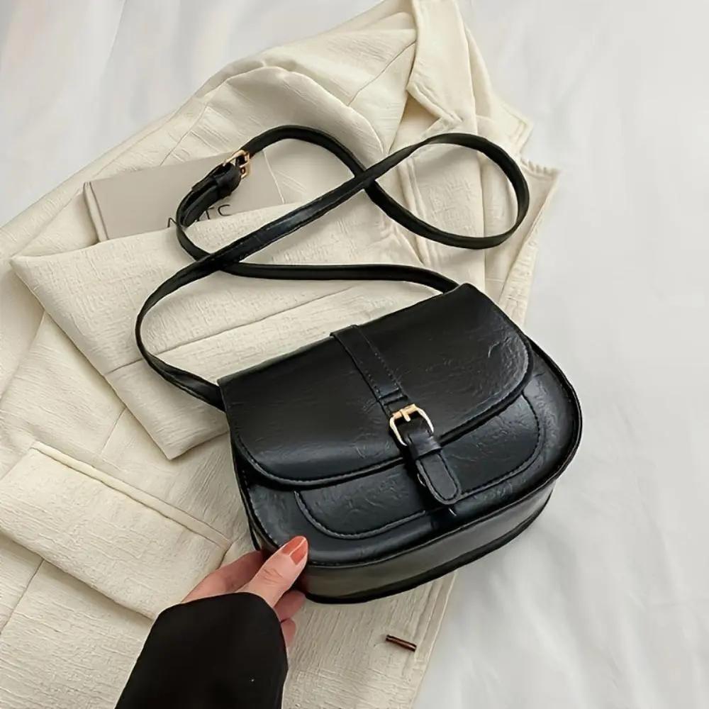Sac à main Sienna Danoir Paris en cuir marron avec poignées en métal, style intemporel et élégant.