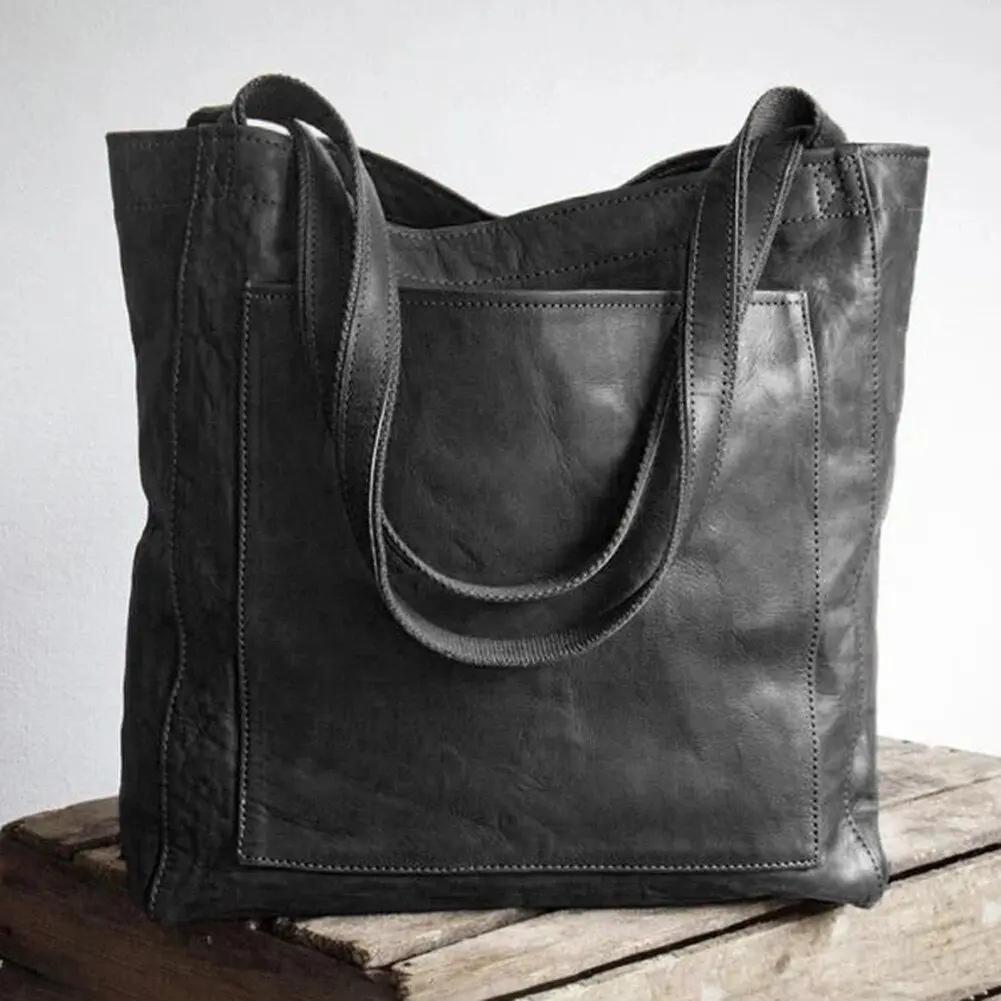 Sac de ville en cuir violet de Danoir Paris, élégant et spacieux avec poignées pour un style chic et décontracté.